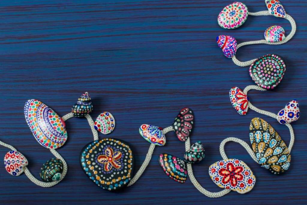 Children's Summer Art Project: Hand-painted colorful dot patterns on sea pebbles and shells 11