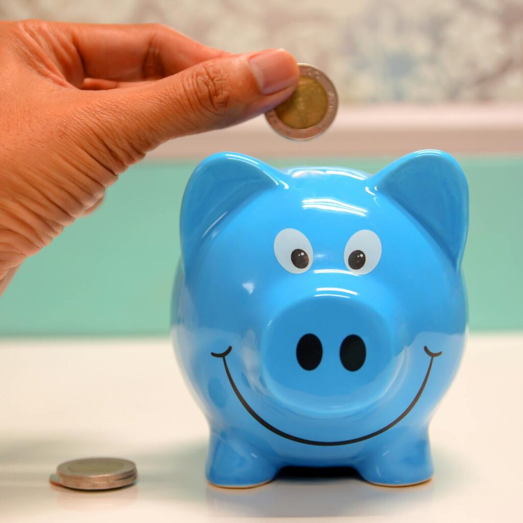 Dear Daughter, Why You Should Prioritize Saving 6 person putting coin in a piggy bank