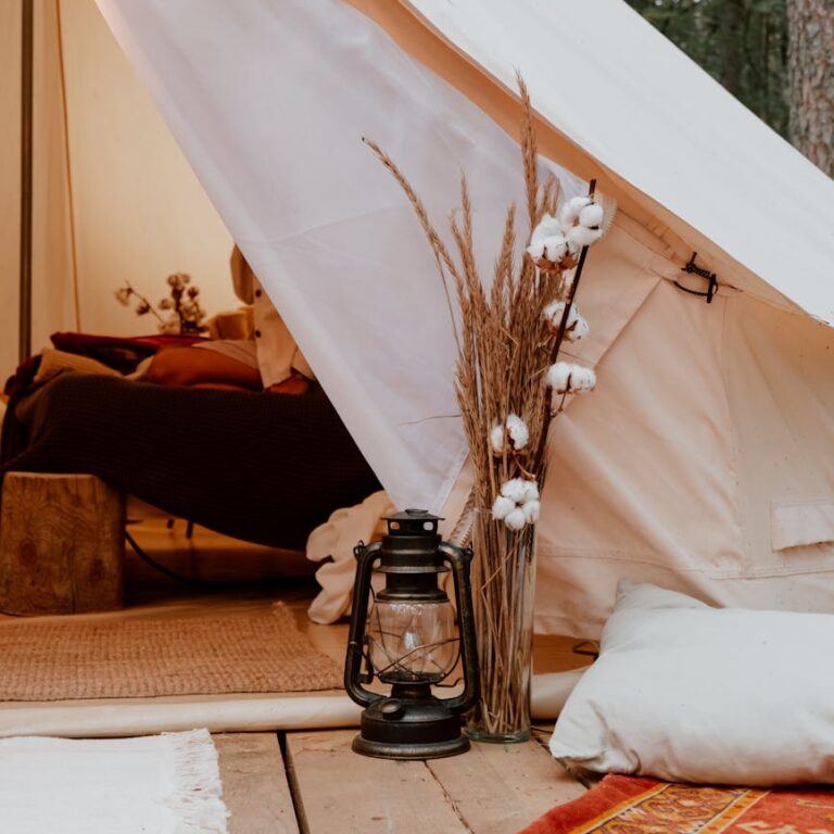 black lantern beside white tent