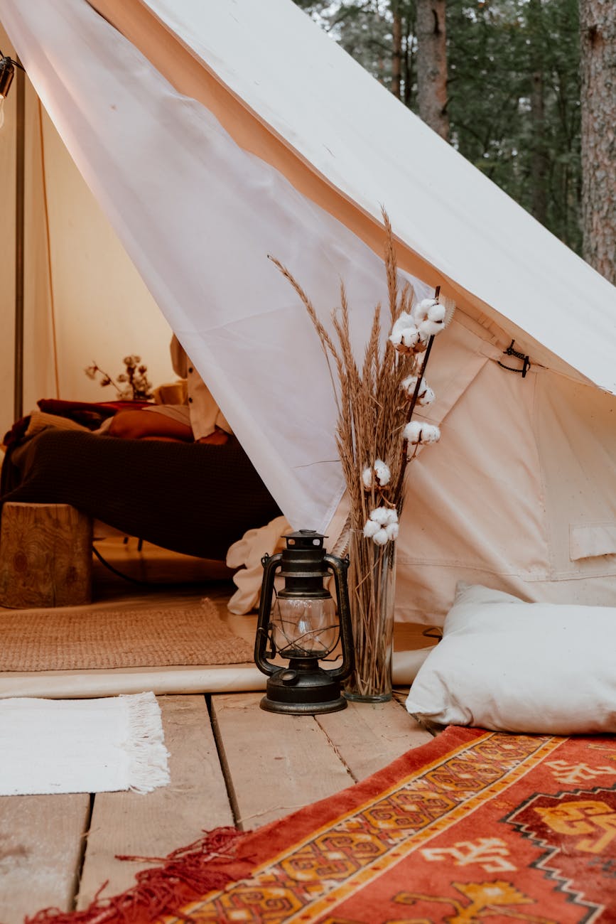 black lantern beside white tent