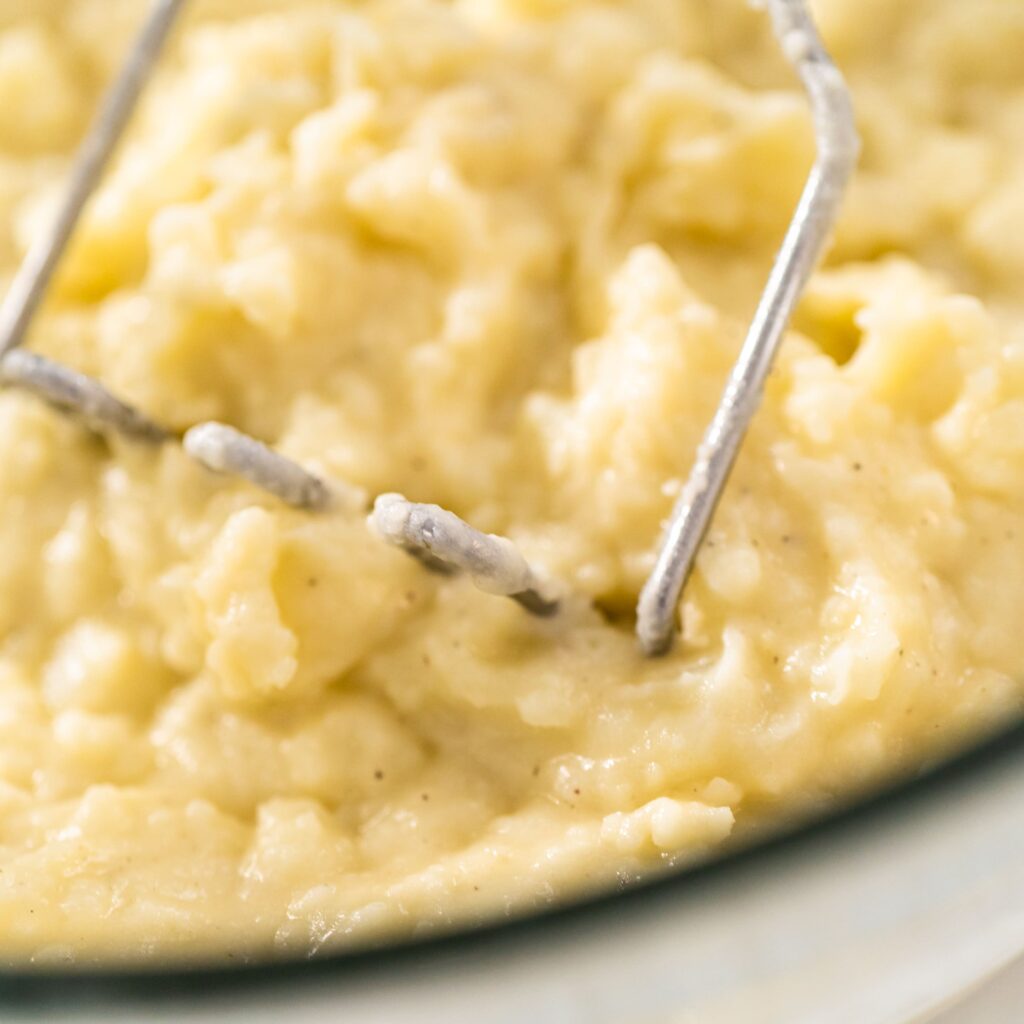 Creamy Instant Pot Mashed Potatoes 7 mashed-potatoes-being-mashed.jpg